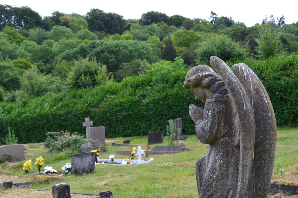 Photo of praying angel memorial in the original formal burial ground.