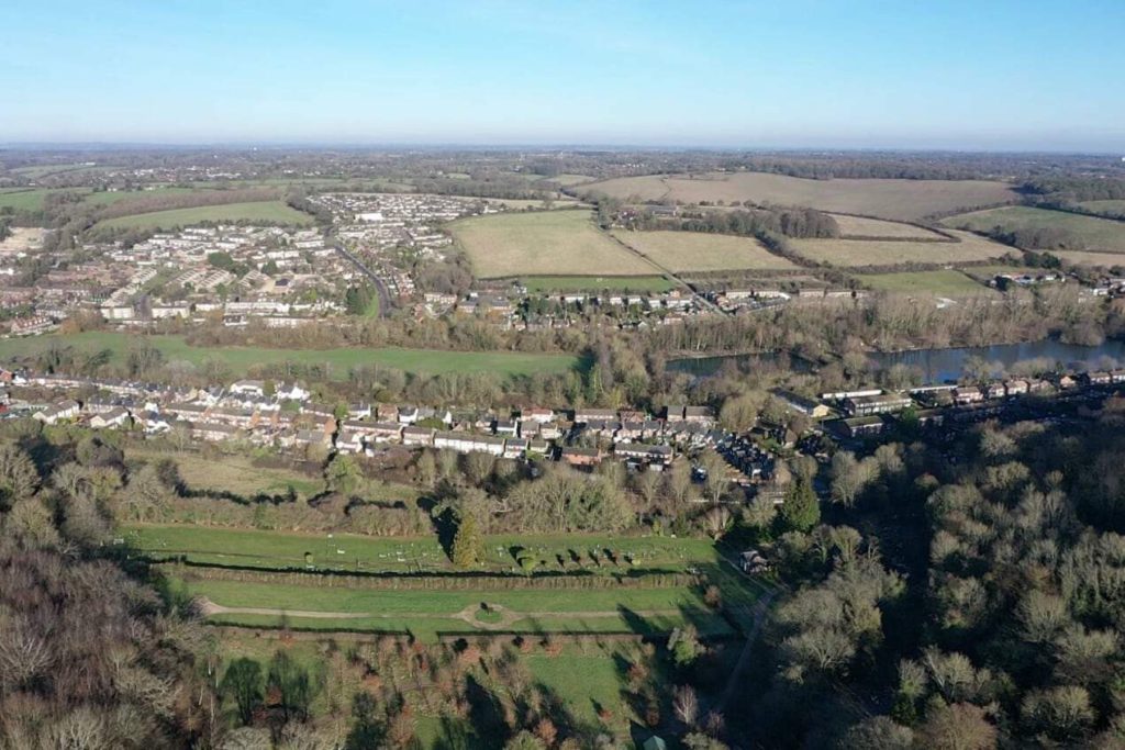 Overhead view of formal and woodland burial ground.  With views of Waterside and hills beyond in background.